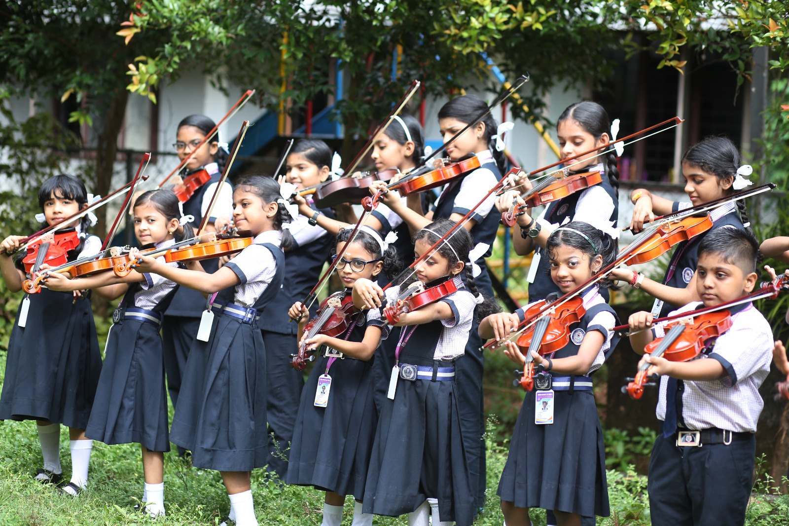 Students practising the violin